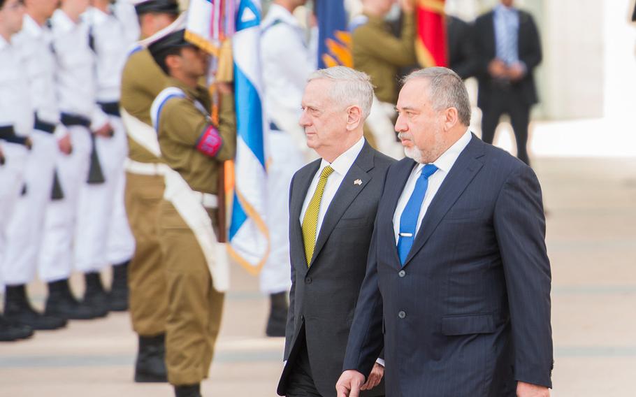 Israeli Defense Minister Avigdor Lieberman, right, reviews an honor cordon in Tel Aviv with U.S. Defense Secretary Jim Mattis on Friday, April 21, 2017.