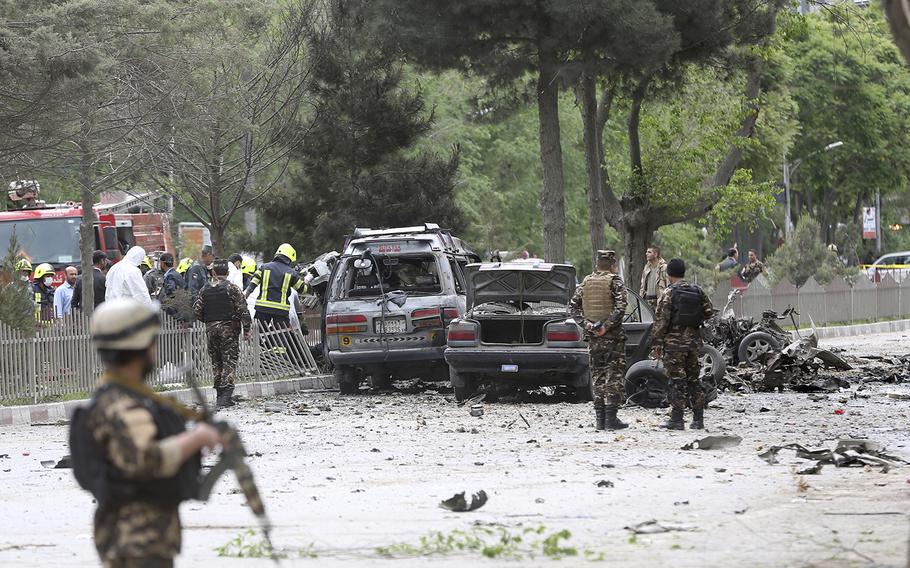 Security forces inspect the site of a suicide attack in Kabul, Afghanistan, Wednesday, May 3 , 2017.  Afghan officials say three U.S. soldiers were wounded in the attack. 