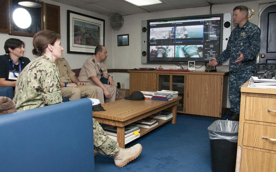 Capt. Christopher Wells, commanding officer of Afloat Forward Staging Base (Interim) USS Ponce, discusses Ponce’s capabilities with participants of the International Maritime Exercise (IMX) 2017, a command exercise and includes more than 20 partner nations. 

