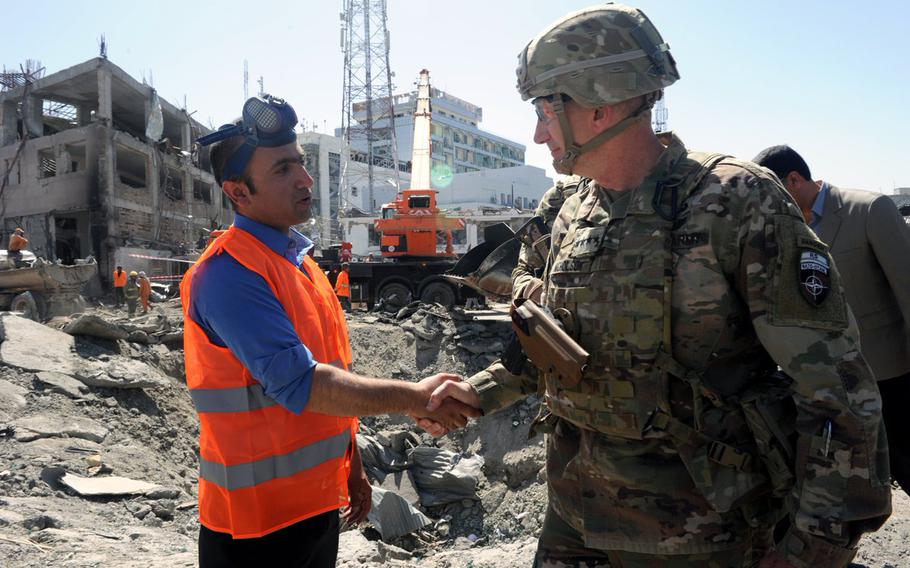 Gen. John Nicholson, commander of U.S. Forces Afghanistan and the Resolute Support Mission, visits the bomb site in Kabul where dozens were killed and hundreds more injured Wednesday, May 31, 2017, when a water tanker laden with explosives detonated on the edge of the heavily fortified diplomatic and government zone.