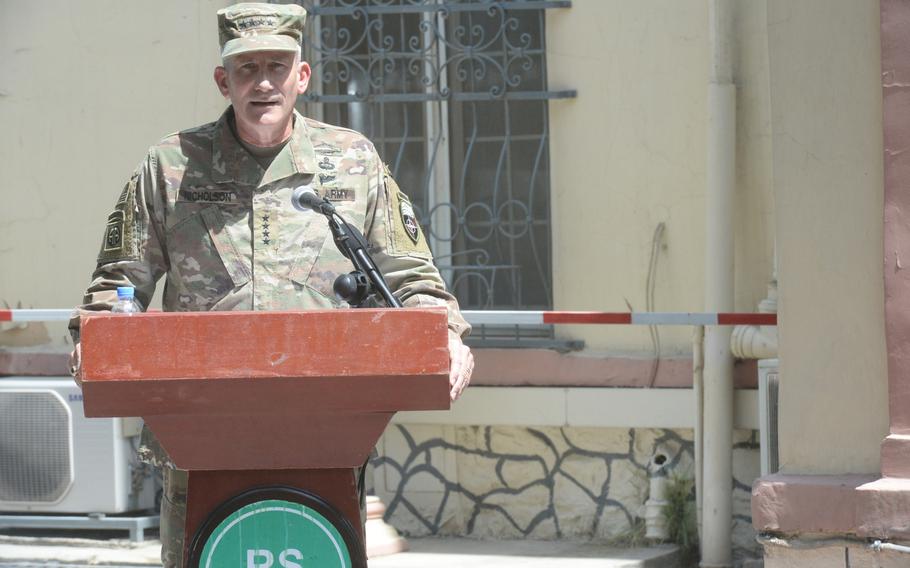 Army Gen. John Nicholson, commander of U.S. forces in Afghanistan, praises the work Army Maj. Gen. Richard G. Kaiser, outgoing commander of Combined Security Transition Command-Afghanistan, and welcomes his successor, Army Maj. Gen. Robin L. Fontes, at a change-of-command ceremony in Kabul on Saturday, July 15, 2017.