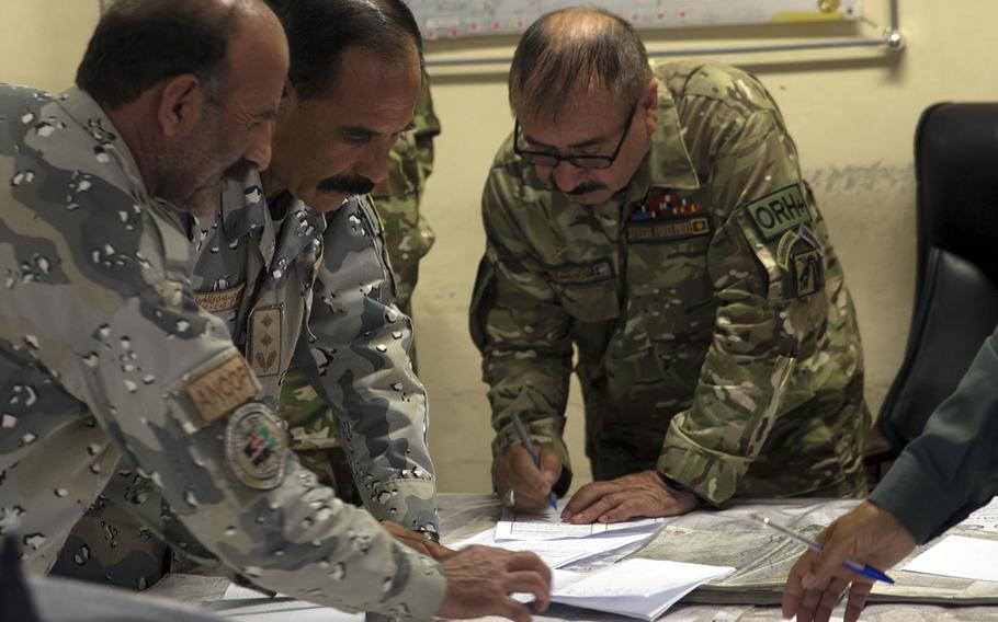 Afghan National Defense and Security Forces complete operational planning for Operation Maiwand Four at Bost Airfield, Afghanistan, July 13, 2017. Operation Maiwand four consists of ANDSF working together to clear the Nawa District of any enemy presence and to expand the security belt around Lashkar Gah.