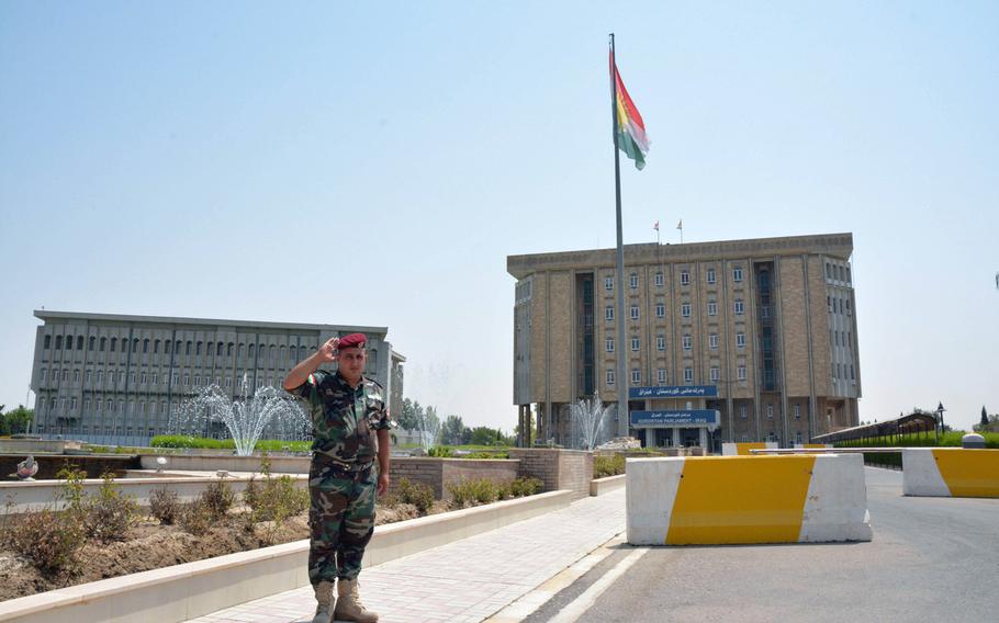 A large Kurdish flag flies in front of the Kurdistan parliament on July 23, 2017.