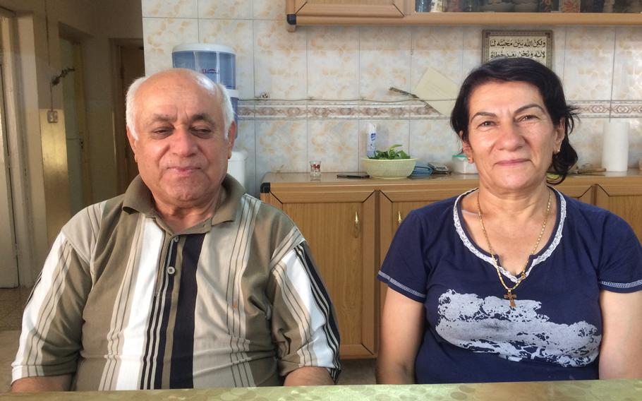 Younan Kosa, 72, and his wife, Amera, 63, a Christian couple living in Irbil's Ankawa neighborhood, are split over whether Kurdistan should seek independence from Iraq.