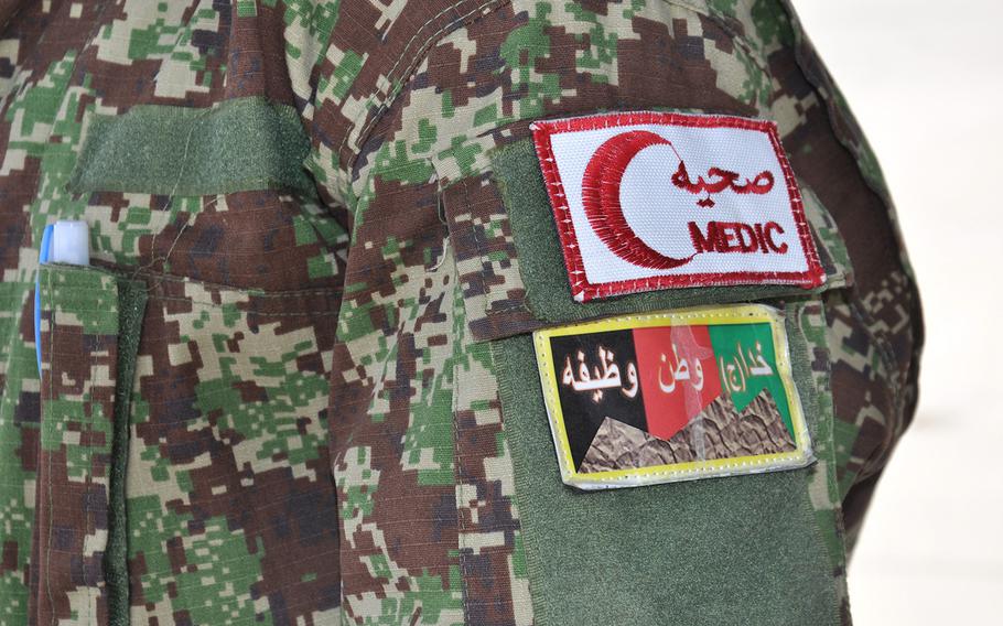 The Afghan National Army medic patch on the sleeve of an ANA flight medic's shoulder at Hamid Karzai International Airport, July 9, 2015. An Afghan official said on Sunday, Aug. 27, 2017, that 10 people have been killed after a suicide car bomber attacked an Afghan army convoy in southern Helmand province.
