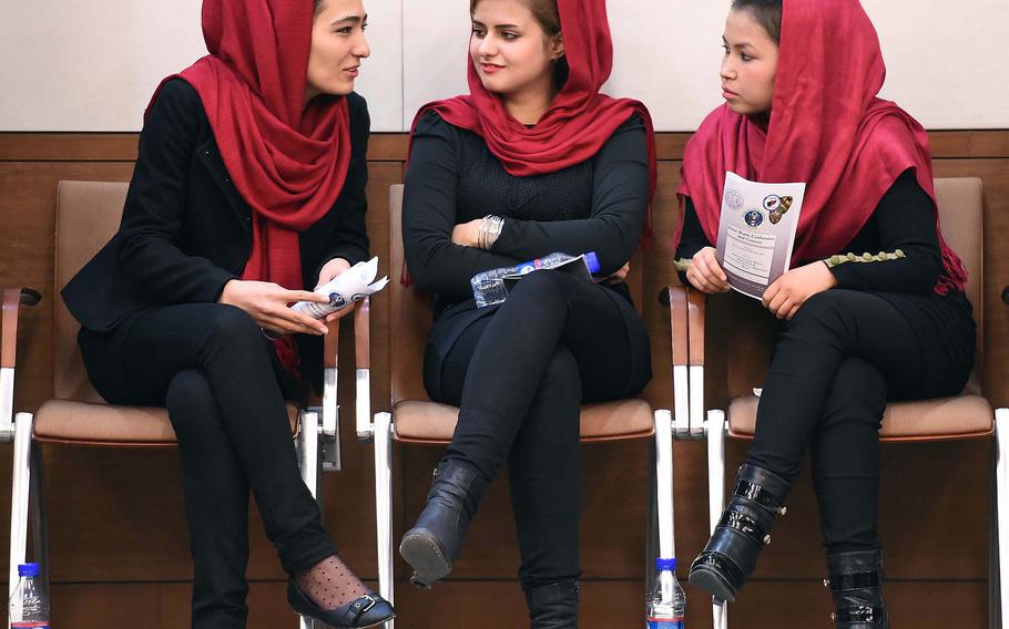 Kabul University students talk before the start of a concert at the U.S. Embassy. They performed with fellow students and instructors and the U.S. Forces Afghanistan Band, Thursday, Jan. 26, 2017.



