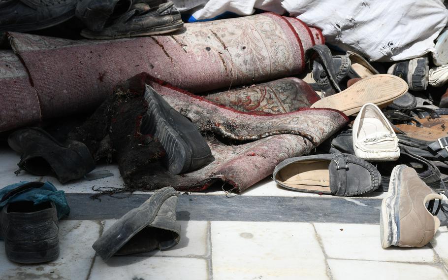 Discarded shoes outside the Imam Zaman mosque in Kabul, Afghanistan, on Saturday, Oct. 21, 2017. An Islamic State suicide bomber attacked the mosque on Friday, killing at least 39 people and injuring over 40 others. 

