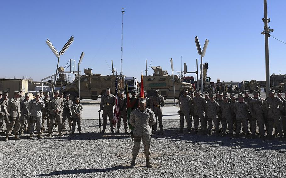 Marines from Task Force Southwest wait at parade rest for the start of a transfer of authority ceremony at Camp Shorab in Helmand province, Afghanistan, on Monday, Jan. 15, 2018. About 300 Marines from the task force's first rotation, represented by the platoon on the left, were relieved by a similarly-sized unit represented by the platoon on the right.