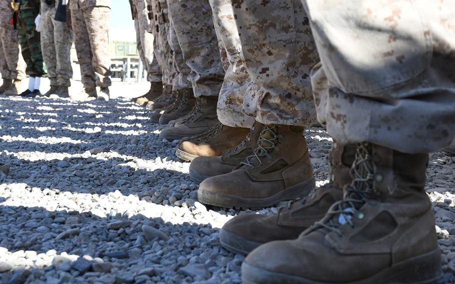 Marines stand in formation during a transfer of authority ceremony for Task Force Southwest at Camp Shorab in Helmand province, Afghanistan, on Monday, Jan. 15, 2018.