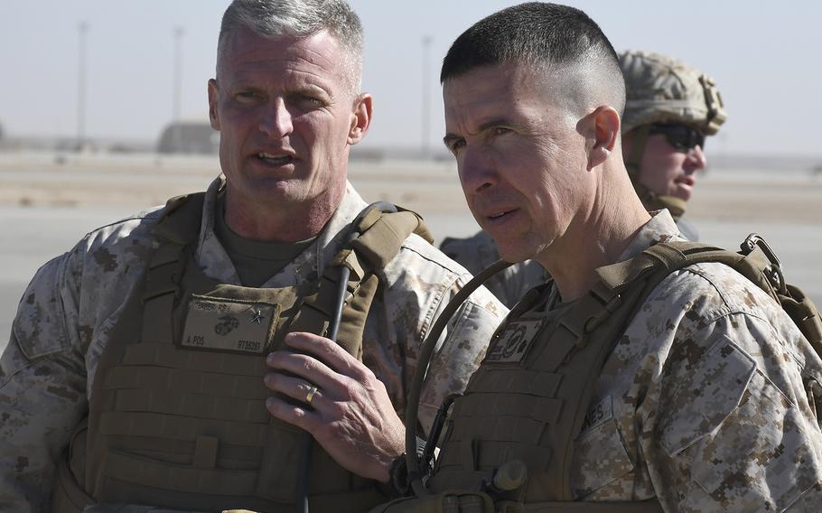 Brig. Gen. Roger B. Turner Jr., left, speaks with Brig. Gen. Benjamin T. Watson on Monday, Jan. 15, 2018, at Camp Shorab in Helmand province, Afghanistan, shortly after Watson assumed command of Task Force Southwest from Turner in a transfer of authority ceremony.