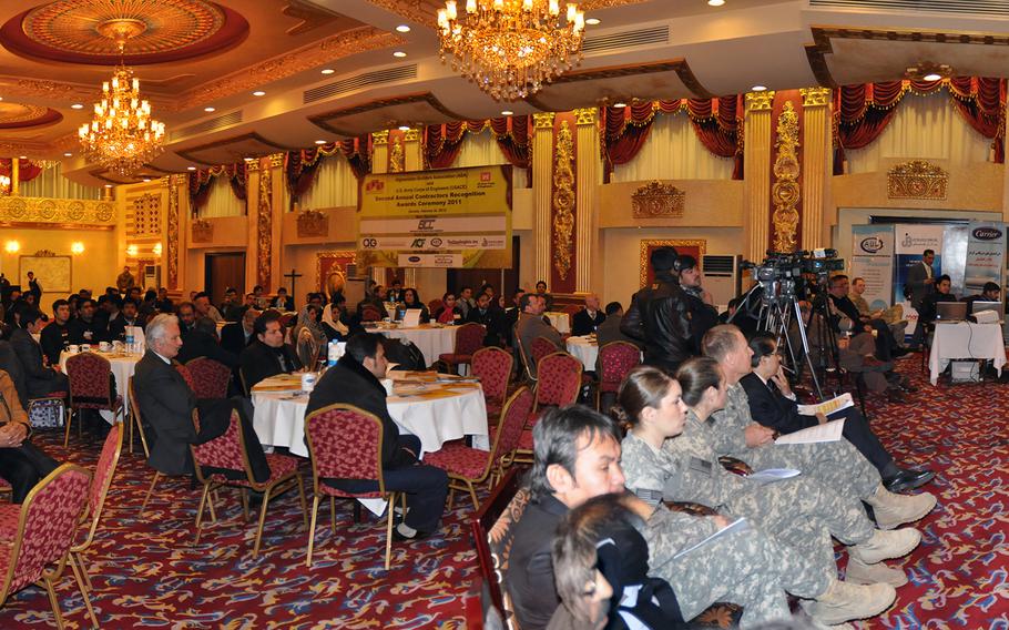 U.S. servicemembers and other guests attend a ceremony at the Intercontinental Hotel in Kabul, Afghanistan, on Feb. 26, 2012.  Gunmen stormed the hotel Saturday, Jan. 20, 2018, in a startling attack on the beleaguered city’s west side. 