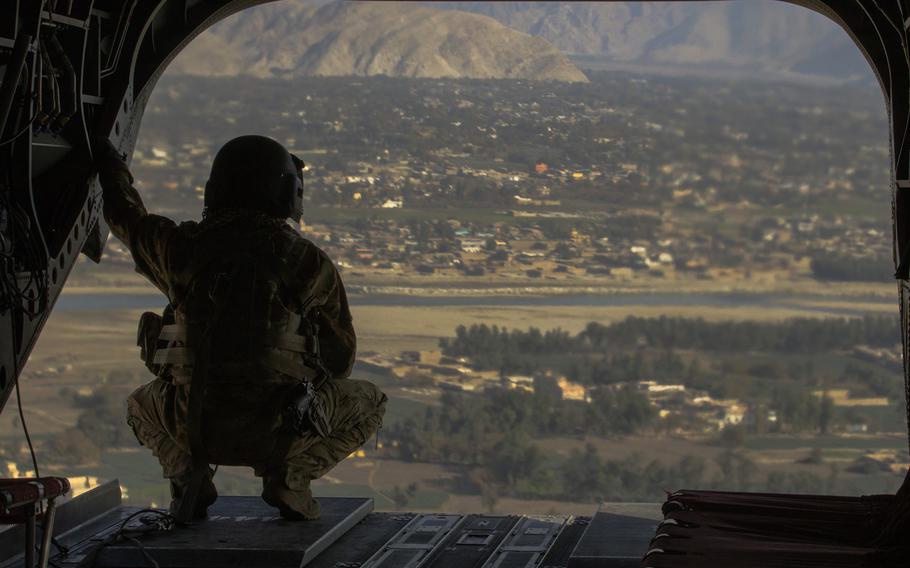 A crew chief surveys the area over Jalalabad, Afghanistan December 5, 2017. The helicopter and its crew are part of Task Force Lighthorse, 3rd Squadron, 17th Cavalry Regiment, out of Savannah, Georgia supporting Operations Freedom's Sentinel and Resolute Support in Afghanistan. 