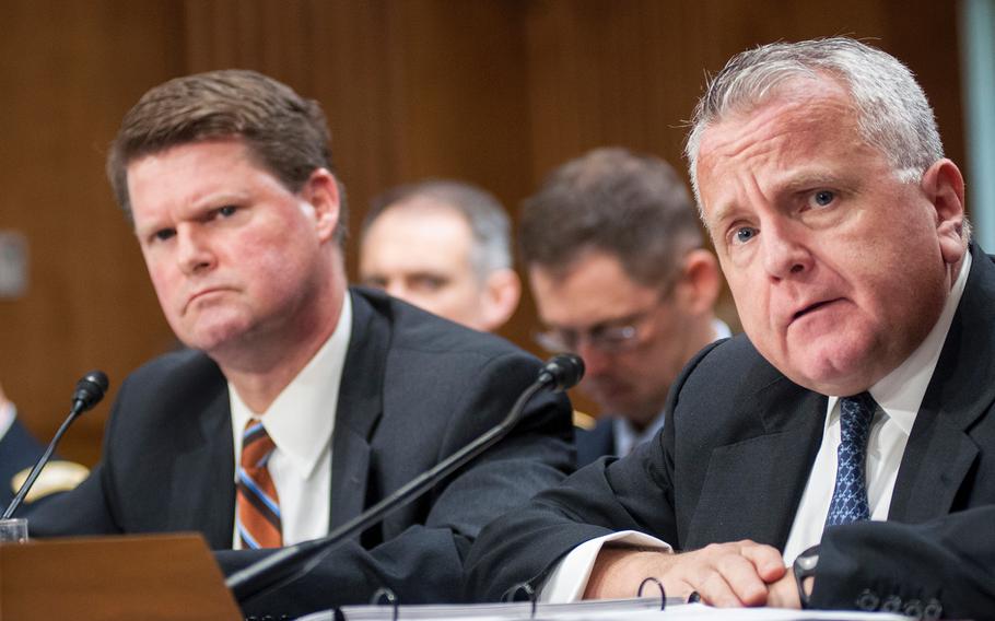 Deputy Secretary of State John Sullivan, right, and Assistant Secretary of Defense for Asian and Pacific Security Affairs Randall Schriver listen to questions during a Senate Committee on Foreign Relations hearing on Capitol Hill in Washington, D.C. on Tuesday, Feb. 6, 2018.