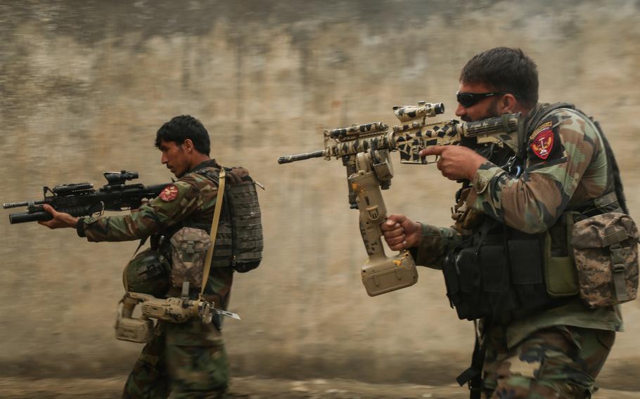 Afghan commandos assigned to 1st Special Operations Kandak clear a training compound during  breaching training in Laghman province, Afghanistan, Feb. 13, 2018. 