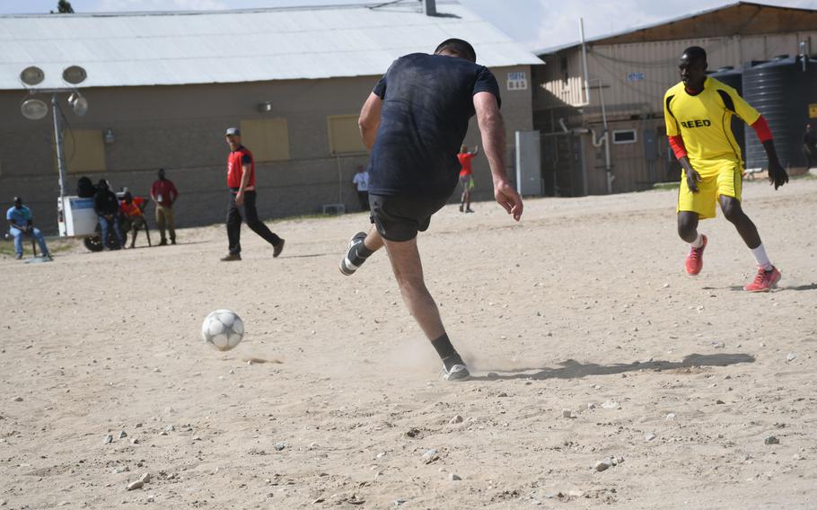 A Georgian player kicks the ball during a soccer match at Bagram Air Filed on Friday, March 23, 2018, during the Bagram World Cup tournament.

