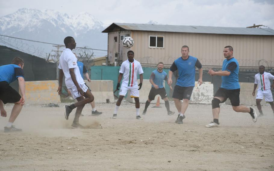 Zimbabwe players in white compete against Czech players in blue during a Bagram World Cup soccer match on Friday, March 23, 2018. 