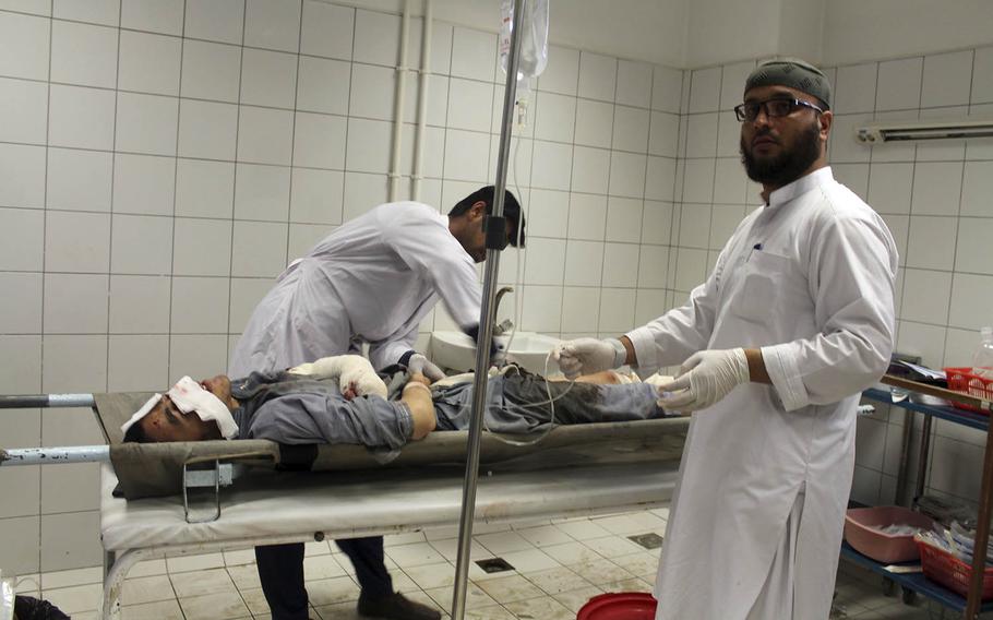 An Afghan man is treated at a hospital following an airstrike in Dashti Archi district of Kunduz province northern Afghanistan on May 2, 2018. 