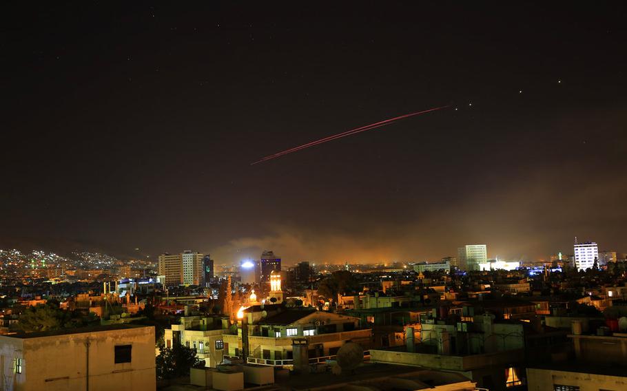 Explosions light up the skies with anti-aircraft fire over Damascus, the Syrian capital, as the U.S. launches an attack early Saturday, April 14, 2018. U.S. President Donald Trump announced airstrikes in retaliation for the country's alleged use of chemical weapons.