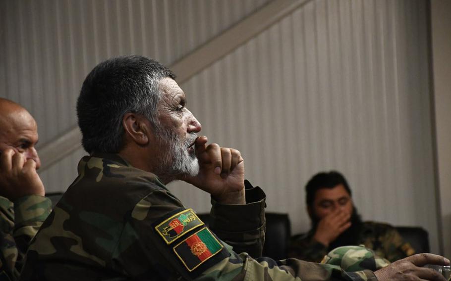 Brig. Gen. Abdul Raziq Safi, commander of the Afghan army's 4th Brigade, 203rd Corps, listens to President Ashraf Ghani during an online call on Friday, June 15, 2018, at a base outside Logar province's capital of Pul-e-Alam.