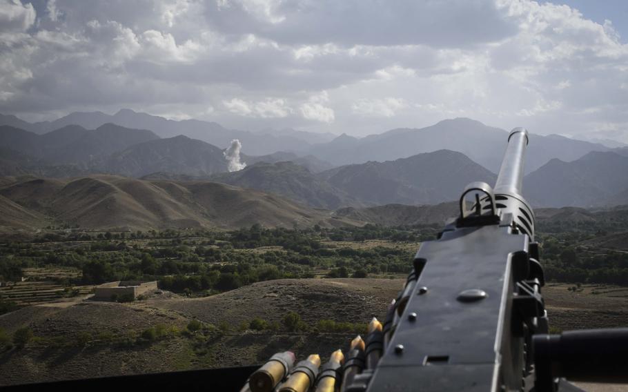 A M-240B machine gunner's view of the aftermath of a bombing run by an U.S. F-16 fighter-bomber against positions held by Islamic State militants in Deh Bala district in Nangarhar province Saturday, July 7, 2018.