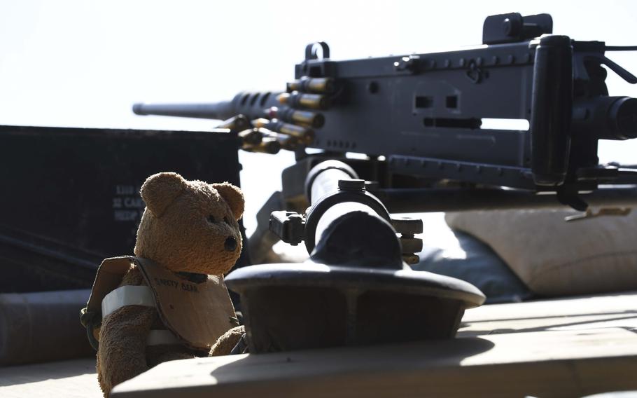 A "safety bear" wears its protective cardboard vest as it guards an M-240B machine gun at the American special forces side of a checkpoint jointly held with Afghan commandos in Deh Bala district in The 3rd Battalion, 1st Special Forces Group assisted Afghan security forces in operations beginning in April and ending in June to capture Gurgoray, the purported capital of Islamic State fighters in the region, military officials said.

