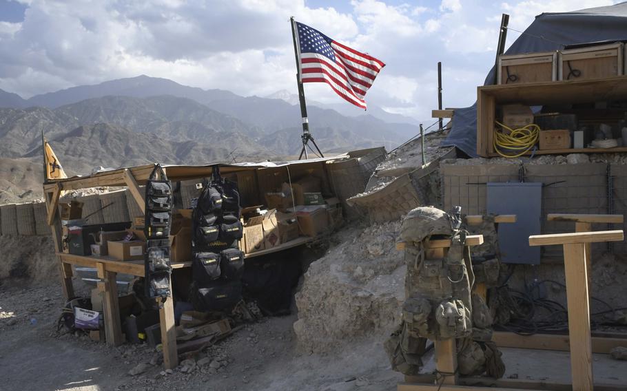A U.S. flag flies over Observation Post Krakken, a checkpoint overlooking a key valley in Deh Bala district in Nangarhar province, Afghanistan, Saturday,  July 7, 2018. 
