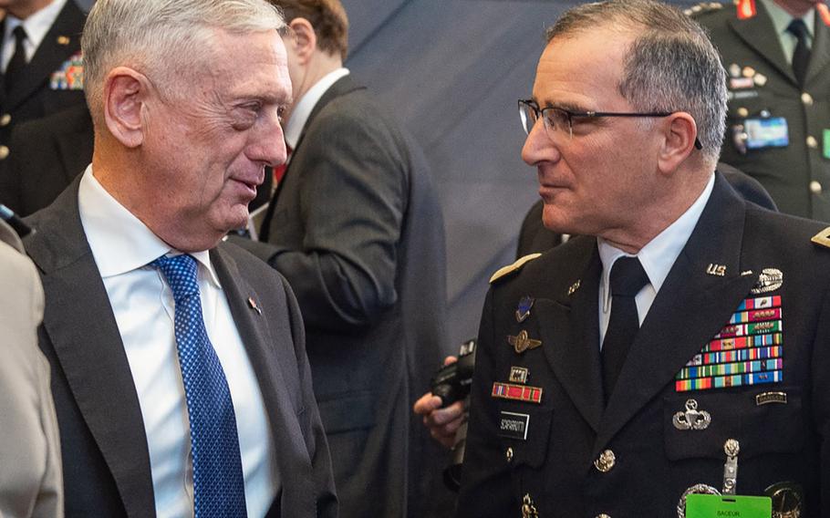 Defense Secretary Jim Mattis talks with Gen. Curtis Scaparrotti, Supreme Allied Commander Europe, during the NATO defense ministers meeting in Brussels, Oct. 4, 2018.