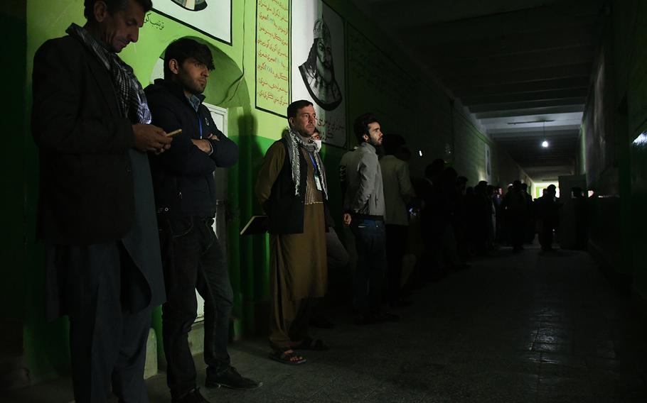 Afghans at a polling center in Kabul’s Qala-e-Fathullah neighborhood queue to vote in the country’s long-delayed parliamentary elections on Saturday, Oct. 20, 2018.