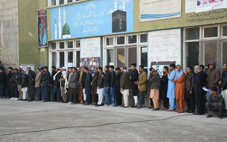 Afghans at a polling center in Kabul’s Qala-e-Fathullah neighborhood wait to vote in the country’s long-delayed parliamentary elections on Saturday, Oct. 20, 2018. 