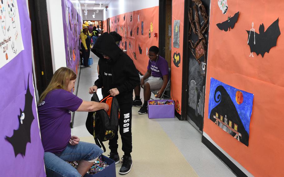 Children in costumes trick-or-treat for candy in the hall at the Bahrain School’s Spooktakular event on Thursday, Oct. 25, 2018. 