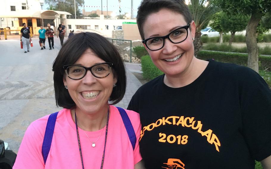 Penelope Miller-Smith, elementary school principal, and Julie Frerot, special education teacher and event organizer, pose for a photo at the Bahrain School’s Spooktakular event Thursday, Oct. 25, 2018.
