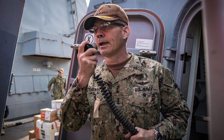 Vice Adm. Scott Stearney, commander of U.S. Naval Forces Central Command, U.S. 5th Fleet and Combined Maritime Forces, speaks on the 1MC shipboard intercom to welcome the crew of the guided-missile destroyer USS Jason Dunham (DDG 109) to Manama, Bahrain, on Oct. 24, 2018.
