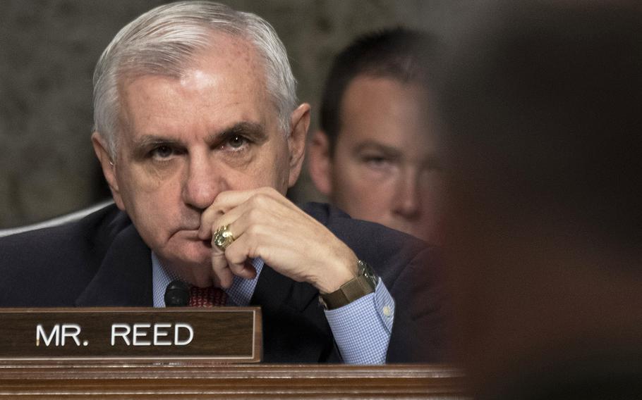 Senate Armed Services Committee Ranking Member Jack Reed, D-R.I., listens to testimony by Lt. Gen. Kenneth F. McKenzie, Jr., foreground, nominee to serve as commander of U.S. Central Command, during a hearing on Capitol Hill, Dec. 4, 2018.