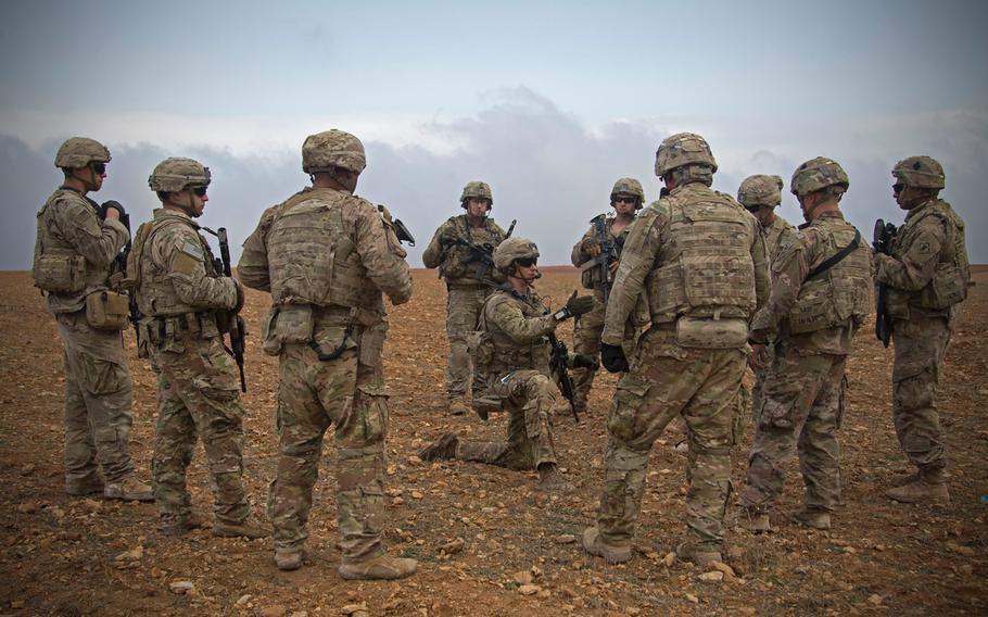 U.S. soldiers gather for a brief during a combined joint patrol rehearsal in Manbij, Syria, Nov. 7, 2018. 