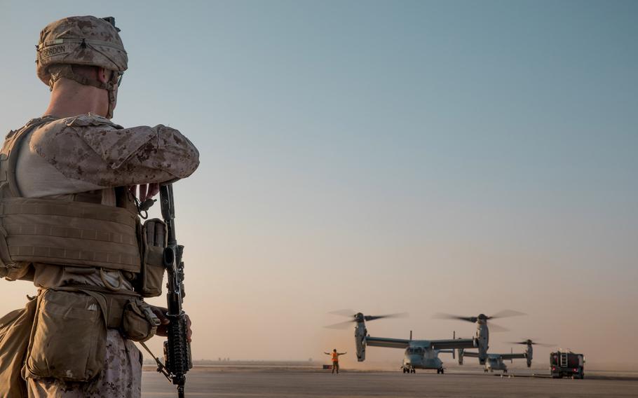 A U.S. Marine with 3rd Battalion, 7th Marine Regiment, prepares to board an MV-22 Osprey on his way to a site near At-Tanf Garrison, Syria, Sept. 7, 2018. The White House announced Wednesday, Dec. 19, 2018, that U.S. forces will start withdrawing from Syria after defeating the Islamic State in the country. 