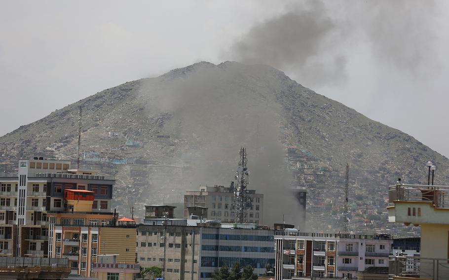 Smokes rises after a huge explosion near the offices of the attorney general in Kabul, Afghanistan, Wednesday, May 8, 2019.