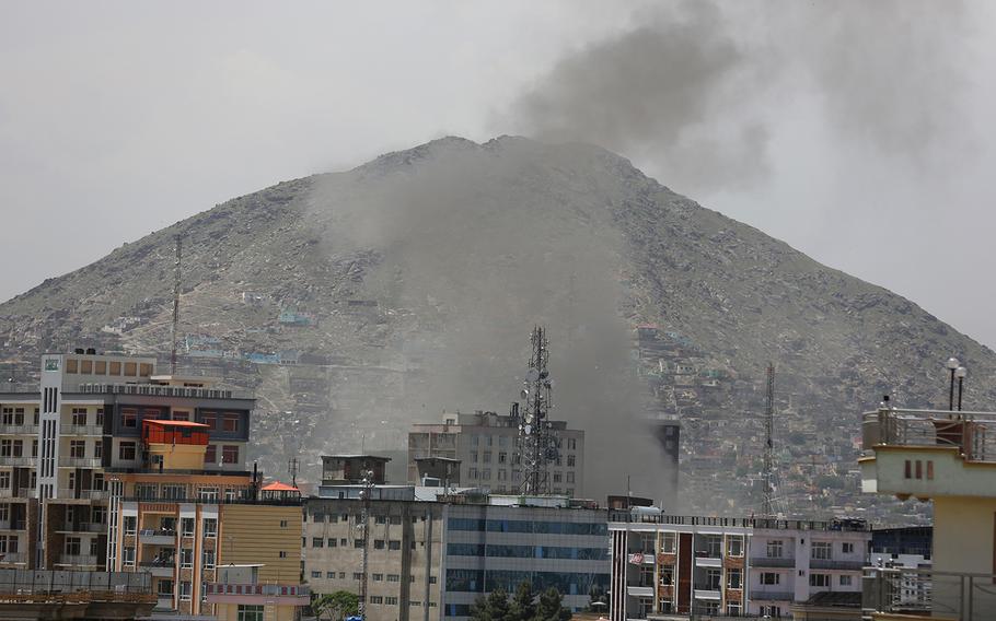 Smokes rises after a huge explosion near the offices of the attorney general in Kabul, Afghanistan, Wednesday, May 8, 2019. 