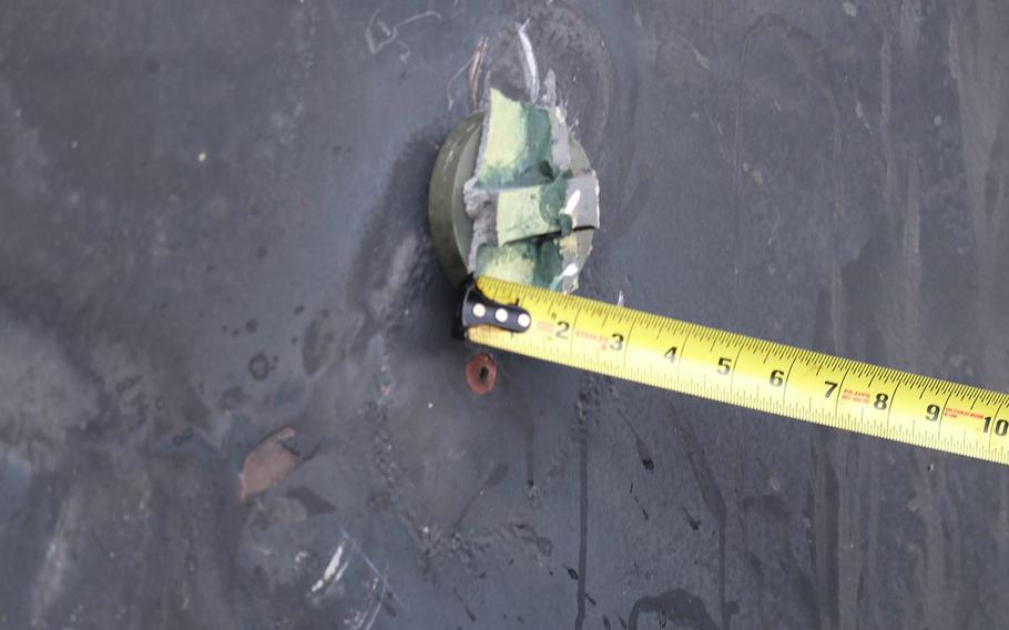 This photo depicts the aluminum and green composite material left behind following removal of an unexploded limpet mine used in an attack on the starboard side of motor vessel M/T Kokuka Courageous, while operating in the Gulf of Oman, June 13, 2019.