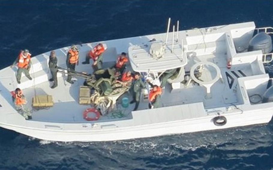 Imagery taken from a U.S. Navy MH-60R helicopter of the Islamic Revolutionary Guard Corps Navy after removing an unexploded limpet mine from the M/T Kokuka Courageous.