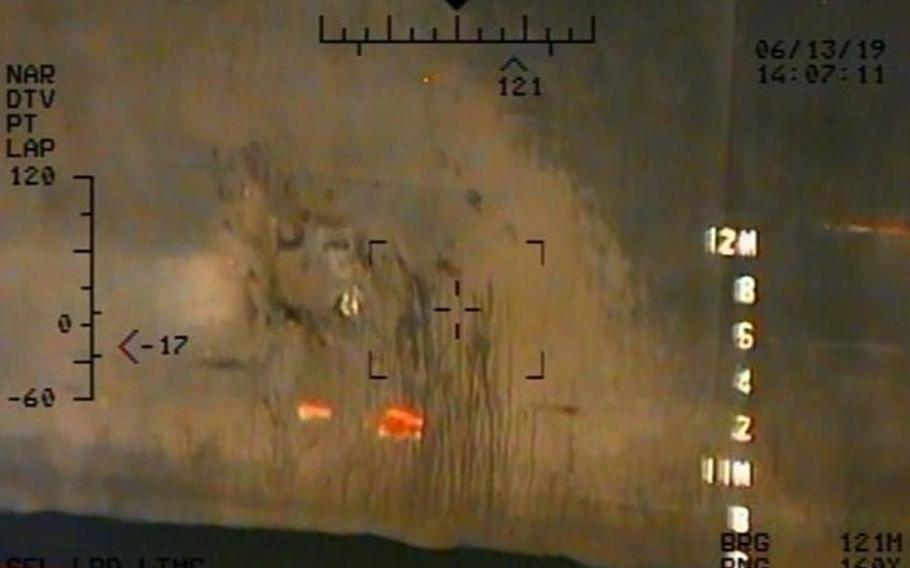 Imagery taken from a U.S. Navy MH-60R helicopter of the Islamic Revolutionary Guard Corps Navy of the remnants of the magnetic attachment device of unexploded limpet mine from the M/T Kokuka Courageous.