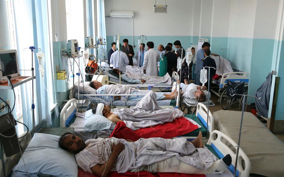 Wounded people receive treatment in a hospital after a powerful bomb blast in Kabul, Afghanistan, Monday, July 1, 2019. A powerful bomb blast rocked the Afghan capital early Monday, rattling windows, sending smoke billowing from Kabul's downtown area and wounding dozens of people. 