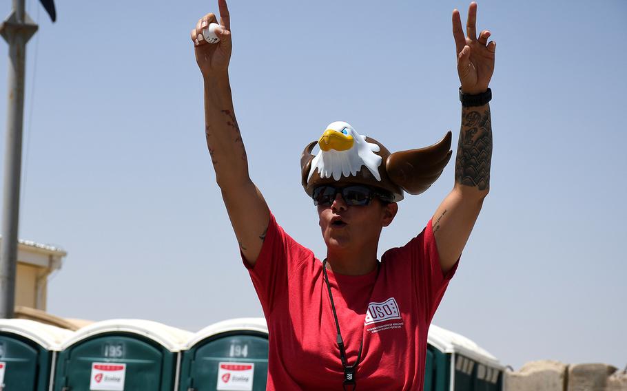 First Sgt. Bobbie Vasquez celebrates during a game of alcohol-free beer pong at Forward Operating Base Dahlke, in Afghanistan's Logar province on Thursday, July 4, 2019. The game was part of Independence Day celebrations at the base. 