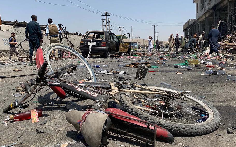 A damaged bicycle is seen at the site of a suicide attack in Kabul, Afghanistan, Thursday, July 25, 2019. Afghan police say a suicide bomber blew himself up Thursday in front of a bus carrying Ministry of Mines employees.