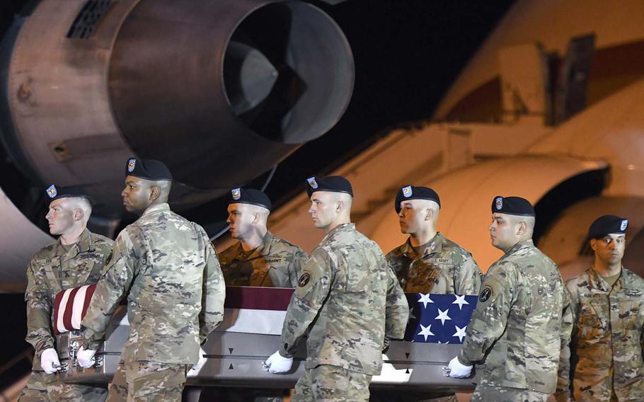 An Army carry team moves a transfer case containing the remains of Spc. Michael I. Nance at Dover Air Force Base, Del., on Wednesday, July 31, 2019. Nance, 24, of Chicago, died July 29, 2019, in Tarin Kowt, Uruzgan province, Afghanistan, from wounds sustained in combat.