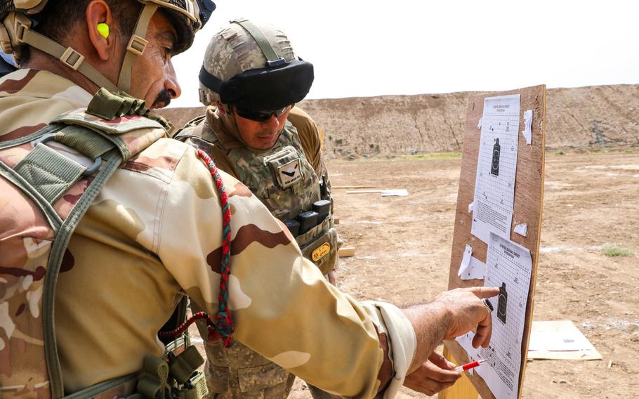 A New Zealand soldier from Task Group Taji gives feedback to an Iraqi soldier from the 23rd Brigade on Camp Taji, Iraq, May 28, 2019. New Zealand has declined a NATO request to retain military advisers in Iraq, a decision that came just prior to a visit from Defense Secretary Mark Esper during his tour of the Pacific. 

