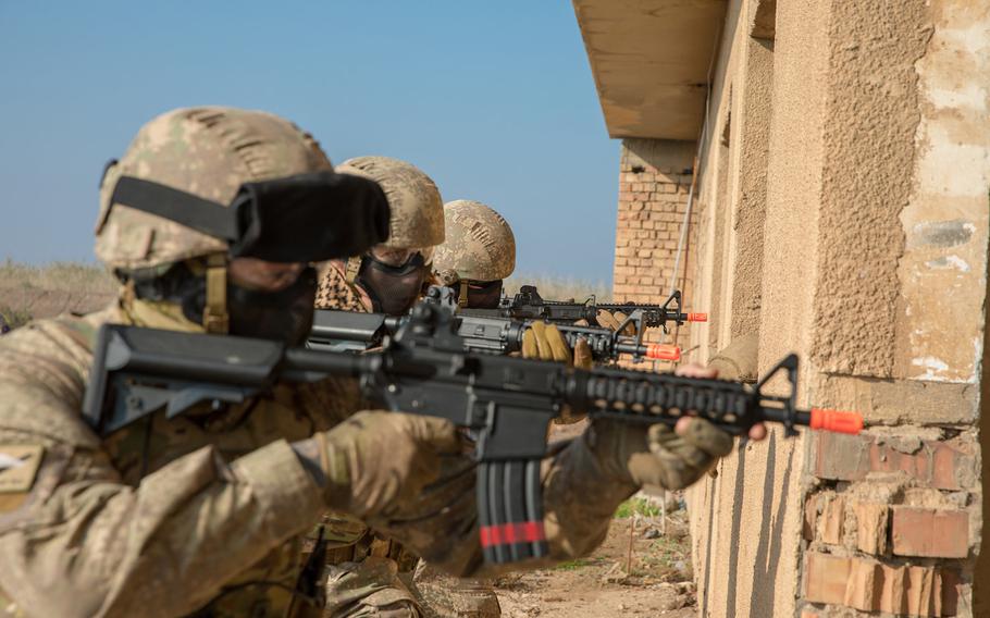 New Zealand soldiers from Task Group Taji use airsoft rifles with simulated munitions to practice urban clearance drills before instructing Iraqis at the Baghdad Fighting School Camp Taji, Iraq, Nov. 27, 2018. New Zealand has declined a NATO request to retain military advisers in Iraq, a decision that came just prior to a visit from Defense Secretary Mark Esper during his tour of the Pacific. 

