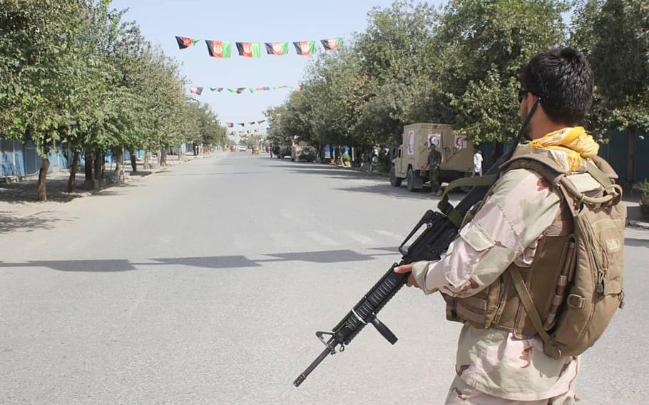 Afghan security forces stand guard during a fight against Taliban fighters in Kunduz province north of Kabul, Afghanistan, Saturday, Aug. 31, 2019.
