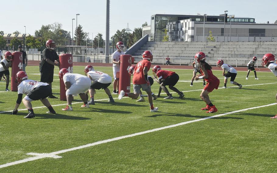 The Kaiserslautern Raiders prepare for an offensive snap during a preseason Kaiserslautern Raiders football practice Friday, Aug. 23, 2019, at Kaiserslautern, Germany. 