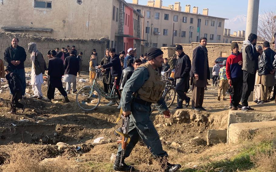 Security personnel arrive near the site of an attack near Bagram Airfield in Parwan province of Kabul, Afghanistan, Wednesday, Dec. 11, 2019.A powerful suicide bombing Wednesday targeted an under-construction medical facility near Bagram Airfield, the main American base north of the capital Kabul, the U.S. military said.