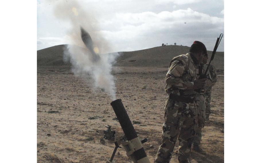 Iraqi army soldiers fire mortars during a live-fire exercise on Jan. 25, 2010, at K1 Base outside of Kirkuk, Iraq. A U.S. contractor was killed and other American and Iraqi service members were wounded Friday evening in a rocket attack at K1.